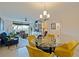 Bright dining area with glass table and yellow chairs at 1316 Pasadena S Ave # 203, South Pasadena, FL 33707