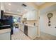 Updated kitchen with stainless steel appliances and white cabinets at 1316 Pasadena S Ave # 203, South Pasadena, FL 33707