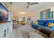 Spacious living room with a large TV and comfortable seating at 1316 Pasadena S Ave # 203, South Pasadena, FL 33707