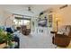 Relaxing living room featuring comfortable seating and a large TV at 1316 Pasadena S Ave # 203, South Pasadena, FL 33707