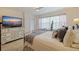 Bright and airy main bedroom with large windows and a dresser at 1316 Pasadena S Ave # 203, South Pasadena, FL 33707