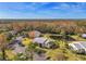 Community overview featuring condos, pond, and mature trees at 1400 Pine Glen Ln # B2, Tarpon Springs, FL 34688