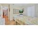 Bedroom with wood floors and access to another room at 19029 Us Highway 19 N # 7-28, Clearwater, FL 33764