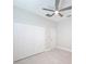 Spacious bedroom with double door closet and ceiling fan at 19212 Sunlake Blvd, Lutz, FL 33558