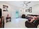 Relaxing living room with leather furniture and sliding door access to backyard at 19212 Sunlake Blvd, Lutz, FL 33558