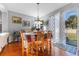 Casual dining area with backyard access and wood flooring at 19538 Timberbluff Dr, Land O Lakes, FL 34638