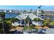 Aerial view of the home showcasing its waterfront location and well-maintained grounds at 224 7Th E St, Tierra Verde, FL 33715