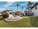 Backyard with a brick oven and outdoor seating area, perfect for entertaining at 224 7Th E St, Tierra Verde, FL 33715