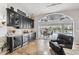 Wet bar area with wine refrigerator and sliding glass doors to the lanai at 224 7Th E St, Tierra Verde, FL 33715