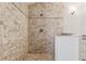 Bathroom featuring a tile shower with an integrated shower head at 224 7Th E St, Tierra Verde, FL 33715
