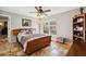 Bedroom with tile floors, ceiling fan and views of the street at 224 7Th E St, Tierra Verde, FL 33715