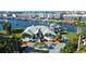 Luxury waterfront home with lush landscaping and boat dock at 224 7Th E St, Tierra Verde, FL 33715