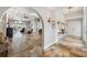Grand foyer with stone floors, archways, and decoratively lit wall accents leads into the adjacent living area at 224 7Th E St, Tierra Verde, FL 33715
