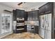 Modern kitchen with stainless steel appliances and custom cabinetry at 224 7Th E St, Tierra Verde, FL 33715