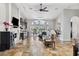 Open-concept living room with a fireplace, tile floors, and plenty of natural light at 224 7Th E St, Tierra Verde, FL 33715