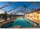 The screened pool provides a comfortable space for swimming, with ample natural light at 224 7Th E St, Tierra Verde, FL 33715