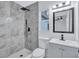 Modern bathroom with gray marble tile shower and gray vanity at 2254 66Th S Ave, St Petersburg, FL 33712