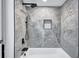 Elegant bathroom with gray marble tile shower and bathtub at 2254 66Th S Ave, St Petersburg, FL 33712