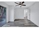 Bedroom with vinyl plank flooring, sliding glass door, and ceiling fan at 2254 66Th S Ave, St Petersburg, FL 33712