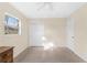 Bedroom with window, ceiling fan and closet at 2418 N Links Ave, Sarasota, FL 34234