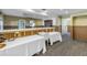 A bar area with a sink, white countertops, and two covered tables at 323 Coffee Pot Ne Dr, St Petersburg, FL 33704