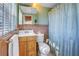 Bathroom featuring a shower/tub combo, a single vanity, and tile flooring at 323 Coffee Pot Ne Dr, St Petersburg, FL 33704