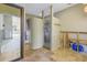Bathroom with tile floor, shower, and bathtub, currently undergoing renovations at 323 Coffee Pot Ne Dr, St Petersburg, FL 33704