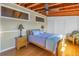 Bedroom with vaulted ceilings, wooden beams, and lots of natural light at 323 Coffee Pot Ne Dr, St Petersburg, FL 33704