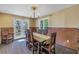 Dining room with wooden table, chairs, and access to the outdoors at 323 Coffee Pot Ne Dr, St Petersburg, FL 33704