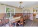 Dining area with a large table, ornate chairs, and a view outside at 323 Coffee Pot Ne Dr, St Petersburg, FL 33704