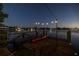 Kayak and chairs on a private dock under the evening sky at 323 Coffee Pot Ne Dr, St Petersburg, FL 33704