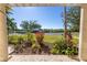 View from the porch of a landscaped front yard with a path leading towards the water at 323 Coffee Pot Ne Dr, St Petersburg, FL 33704