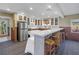 Kitchen with white cabinets, stainless steel appliances, and a breakfast bar at 323 Coffee Pot Ne Dr, St Petersburg, FL 33704