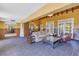 Spacious living room with vaulted ceilings, wood beams, and French doors at 323 Coffee Pot Ne Dr, St Petersburg, FL 33704