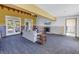 Living room with fireplace, carpet, white walls and view of the pool at 323 Coffee Pot Ne Dr, St Petersburg, FL 33704