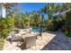 Inviting pool area with patio furniture perfect for relaxation at 323 Coffee Pot Ne Dr, St Petersburg, FL 33704