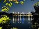 Waterfront view at night with city lights reflecting on the water at 323 Coffee Pot Ne Dr, St Petersburg, FL 33704