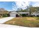 Single-story house with attached garage and neatly landscaped yard at 3404 Baugh Dr, New Port Richey, FL 34655