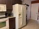Spacious kitchen with white appliances and ample cabinet space at 3480 Hillmoor Dr, Palm Harbor, FL 34685