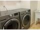 Laundry room featuring a washer and dryer, with a utility sink at 3480 Hillmoor Dr, Palm Harbor, FL 34685