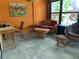 Outdoor patio with wicker furniture and water view at 3480 Hillmoor Dr, Palm Harbor, FL 34685