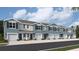 Modern townhouses with attached garages and attractive landscaping at 4202 Red Banks Ln, Bradenton, FL 34208