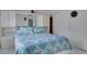 Well-lit bedroom with a mirrored closet and a queen bed at 4215 E Bay Dr # 104, Clearwater, FL 33764
