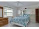 Spacious bedroom with a built-in wardrobe and dresser at 4215 E Bay Dr # 104, Clearwater, FL 33764
