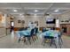 Community dining room with tables and chairs at 4215 E Bay Dr # 104, Clearwater, FL 33764