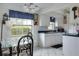 Bright kitchen with white cabinets and tiled floor at 4215 E Bay Dr # 104, Clearwater, FL 33764