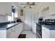 White kitchen with blue countertops and appliances at 4215 E Bay Dr # 104, Clearwater, FL 33764