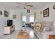 Living room with sofa, coffee table, and TV at 4215 E Bay Dr # 104, Clearwater, FL 33764