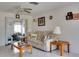 Bright living room features a comfy couch and coffee table at 4215 E Bay Dr # 104, Clearwater, FL 33764