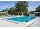 Community pool with plenty of lounge chairs at 4215 E Bay Dr # 104, Clearwater, FL 33764